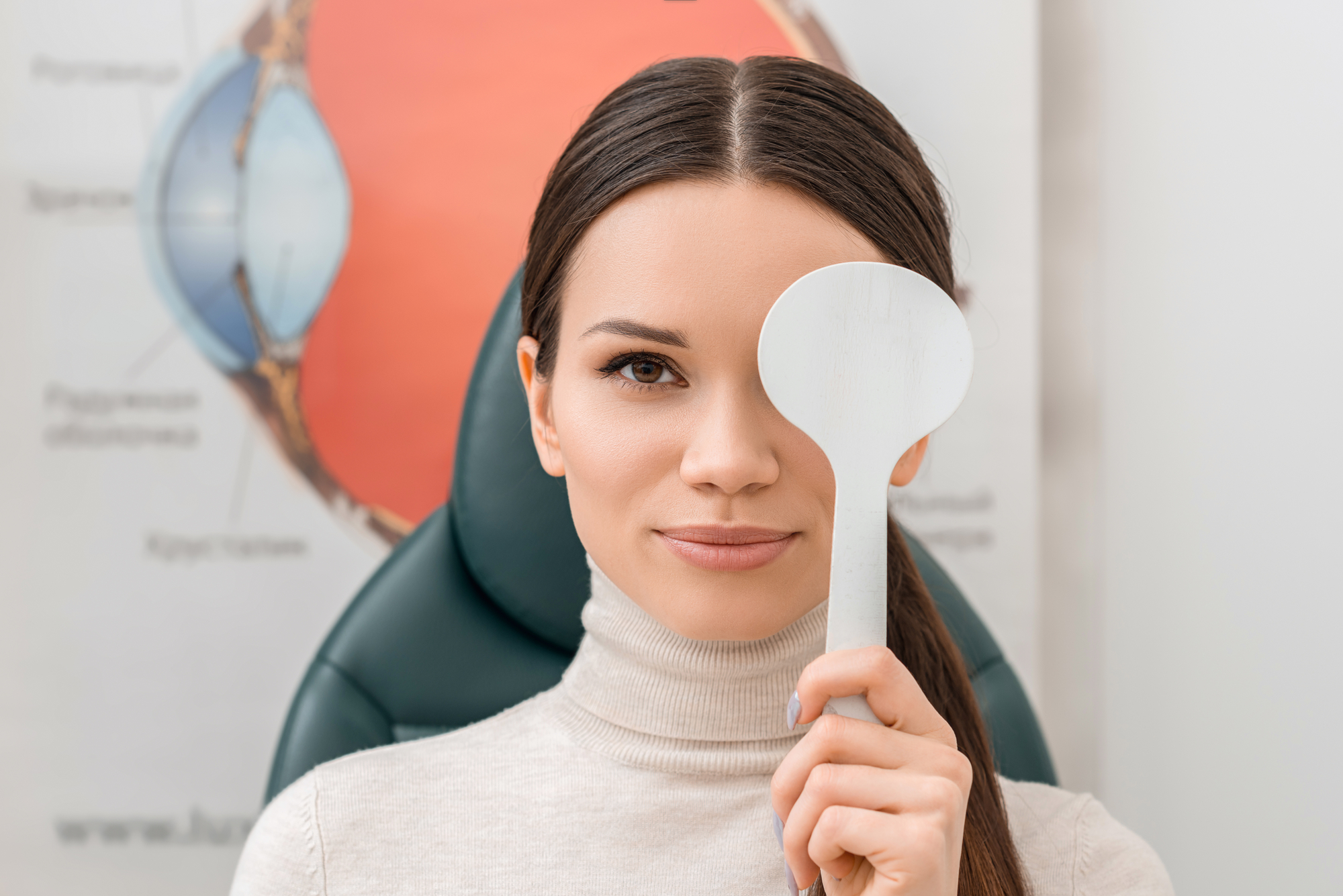 a woman covering her eyes for eye checkup